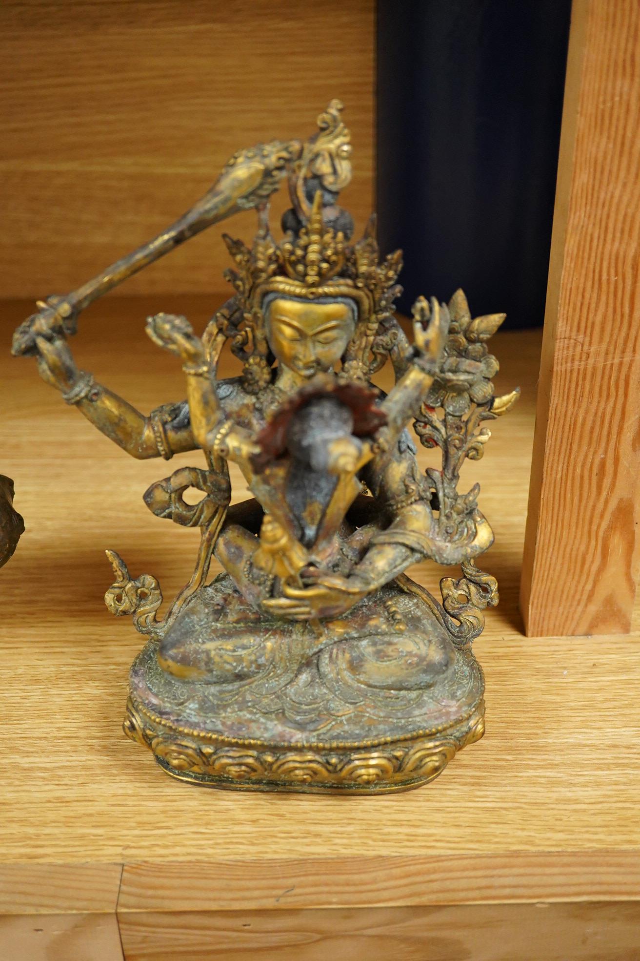 A Sino Tibetan gilt bronze group of Mahakala and consort, 22cm high